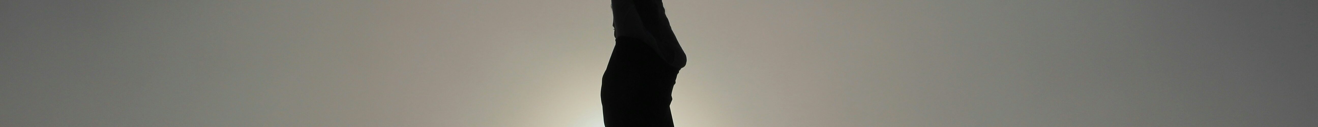 black and white photo of a woman doing yoga