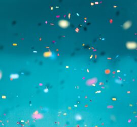 confetti over a blue background