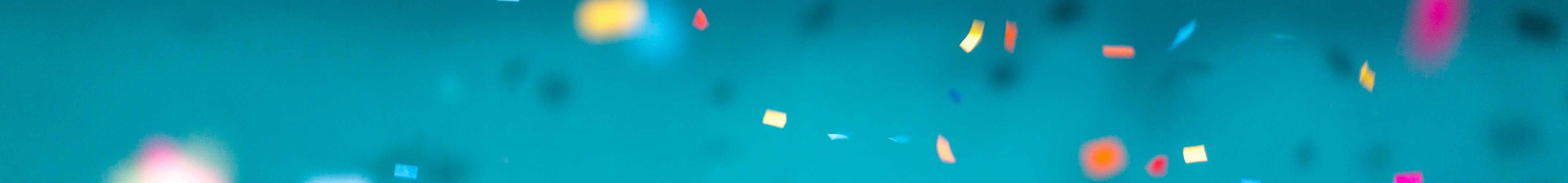 confetti over a blue background