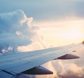 photo of an airplane wing in the sky