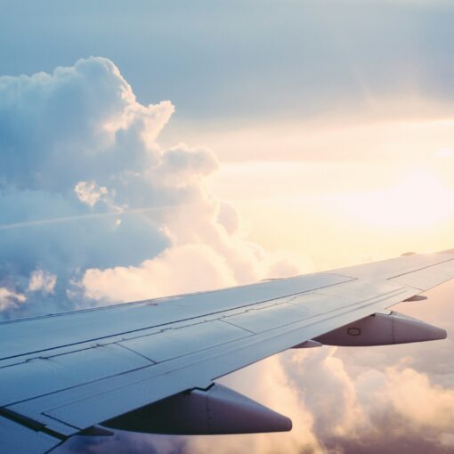 photo of an airplane wing in the sky